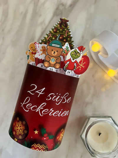 Red Advent calendar with Christmas-themed decorations on a light background